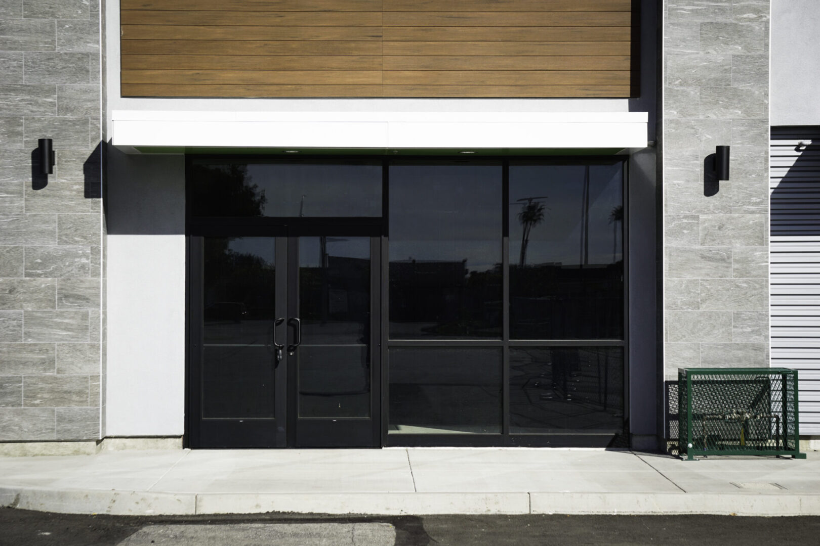 A building with two doors and windows on the outside.